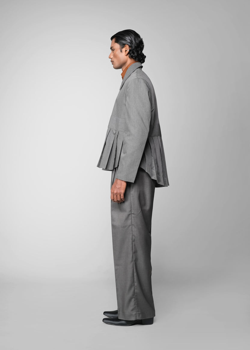 ROSANI The Sanctum jacket in grey - pleated padded blazer with front clasps closure, side view styled with matching trouser