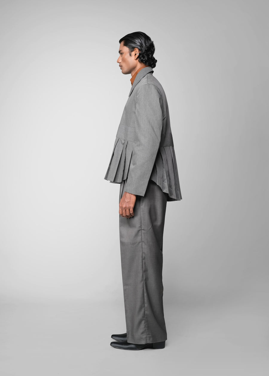 ROSANI The Sanctum jacket in grey - pleated padded blazer with front clasps closure, side view styled with matching trouser