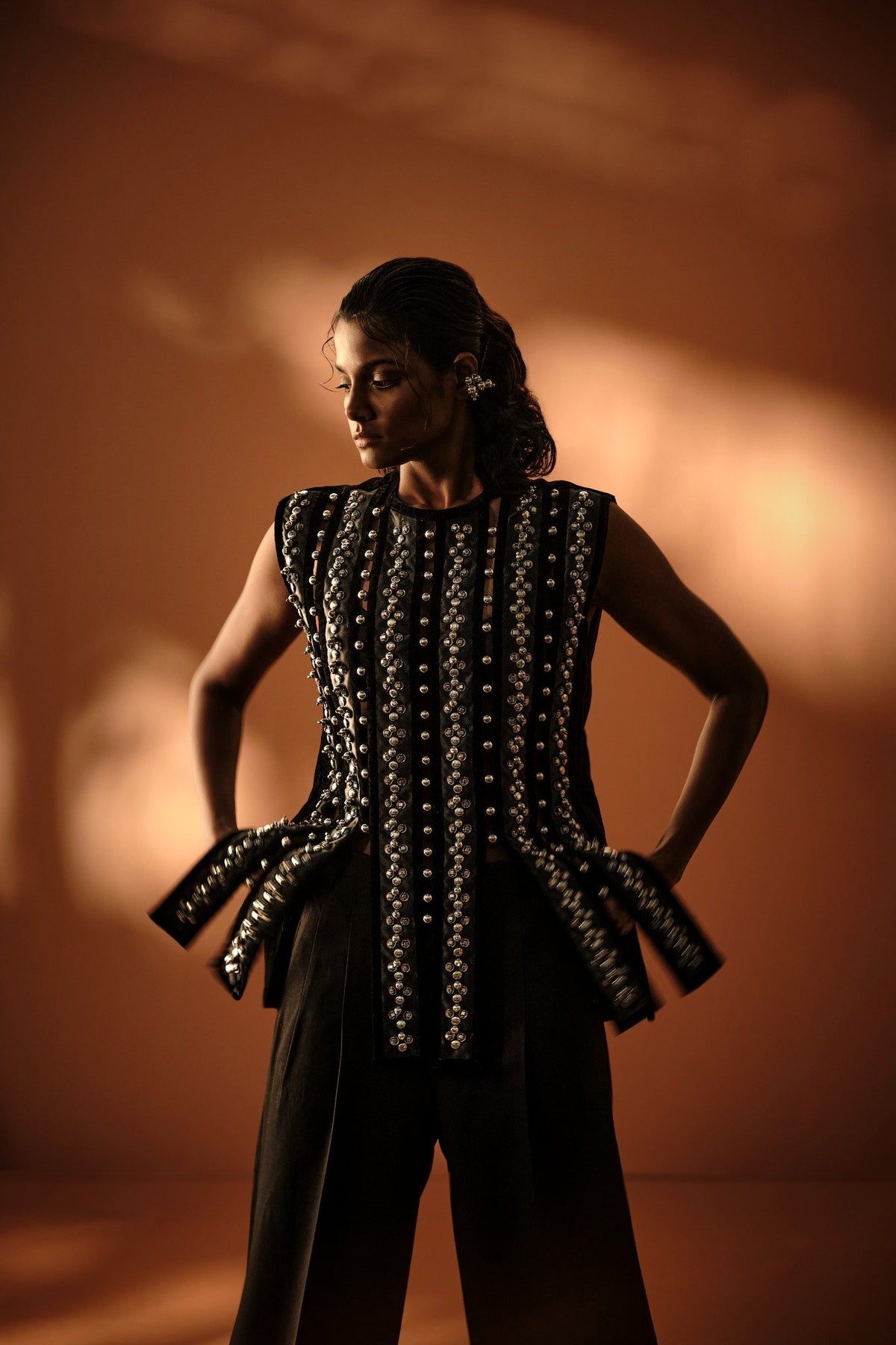 ROSANI The Santuario top in black - sleeveless embellished longline top with vertical metal embroidery stripes, front editorial view
