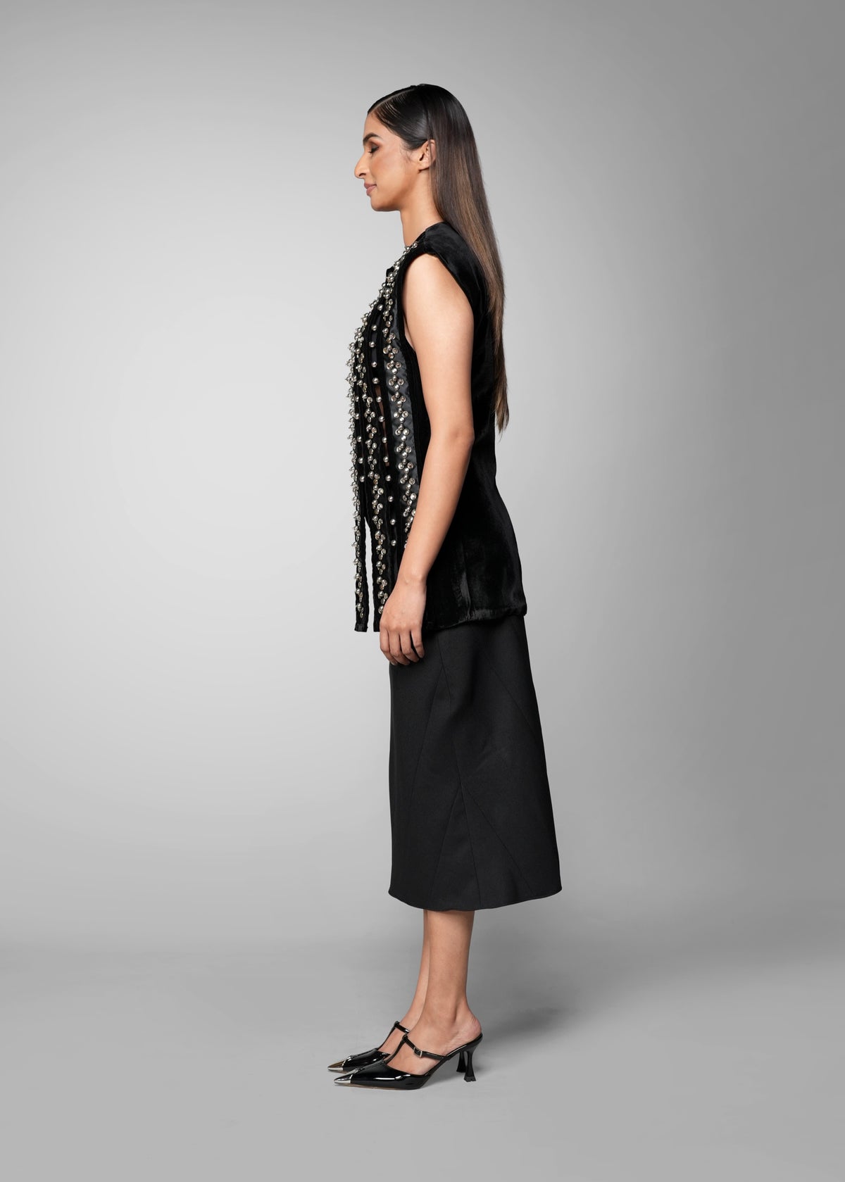 ROSANI The Santuario top in black - sleeveless embellished longline top with vertical metal embroidery stripes, side view