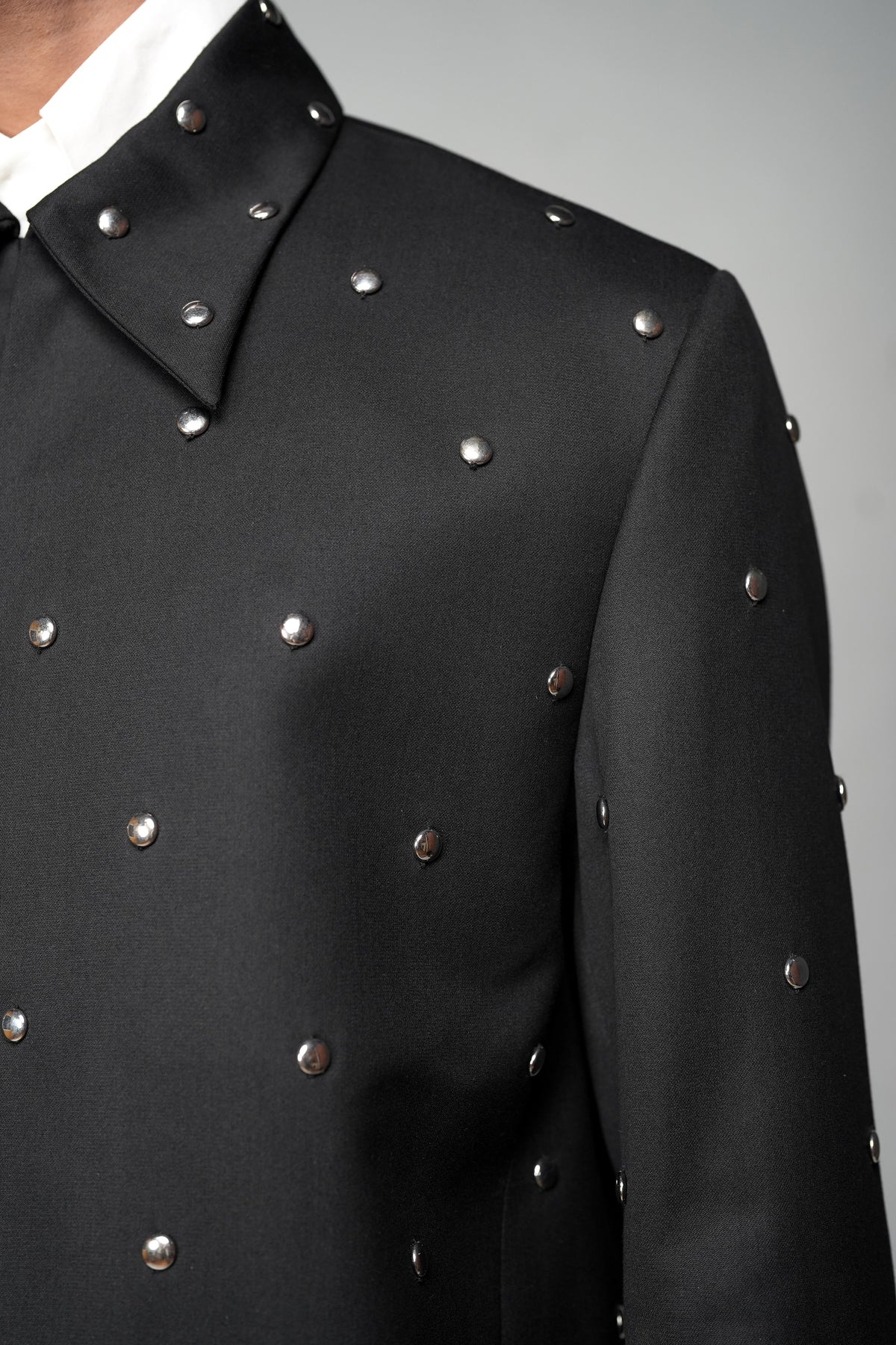 ROSANI The Solum jacket in black - circular metallic embellishment detail, close-up