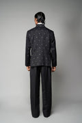 ROSANI The Solum jacket in black - padded blazer with circular metallic embellishment, back view