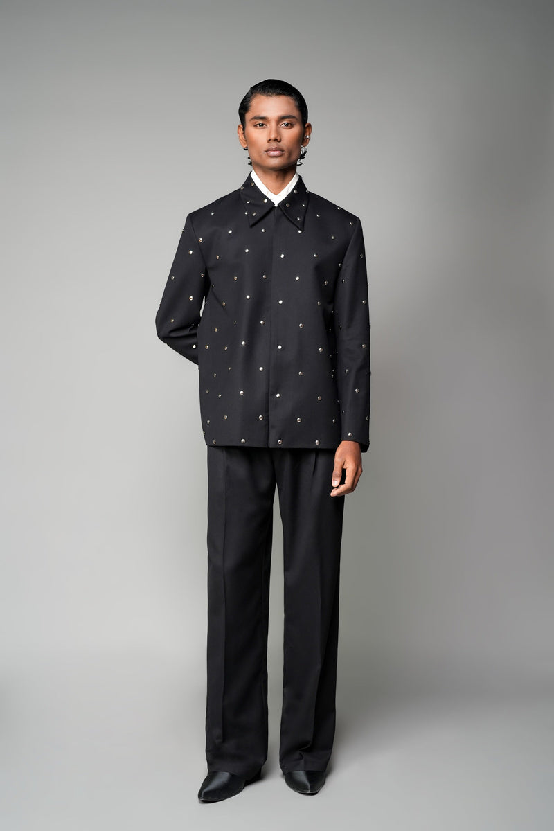 ROSANI The Solumn jacket in black - structured longline jacket with scattered metal stud detailing, front view