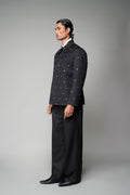 ROSANI The Solum jacket in black - padded blazer with circular metallic embellishment, front side view