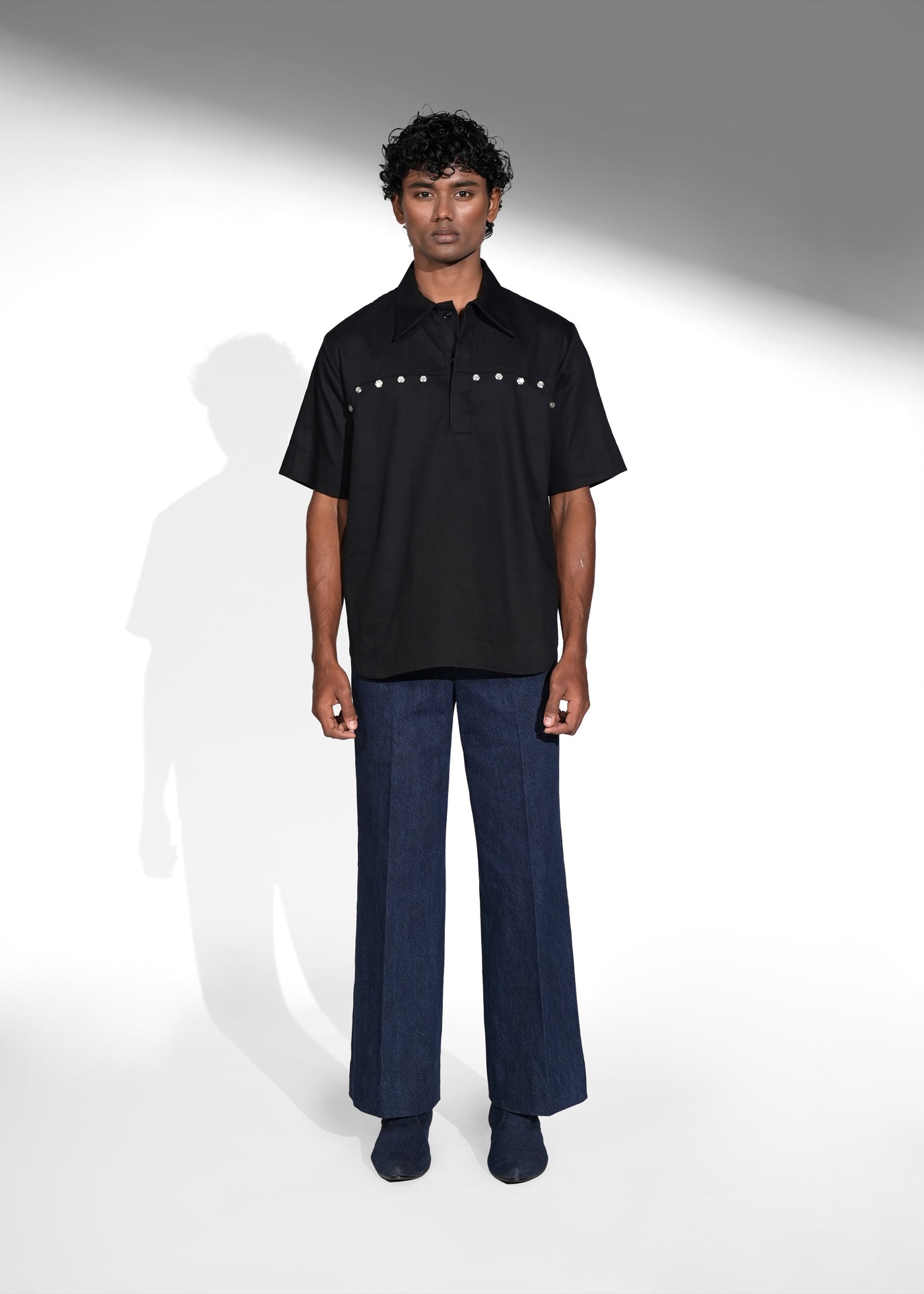ROSANI The Vaulta shirt in black - half-sleeve cotton shirt with metallic button shoulder joint detail, front view
