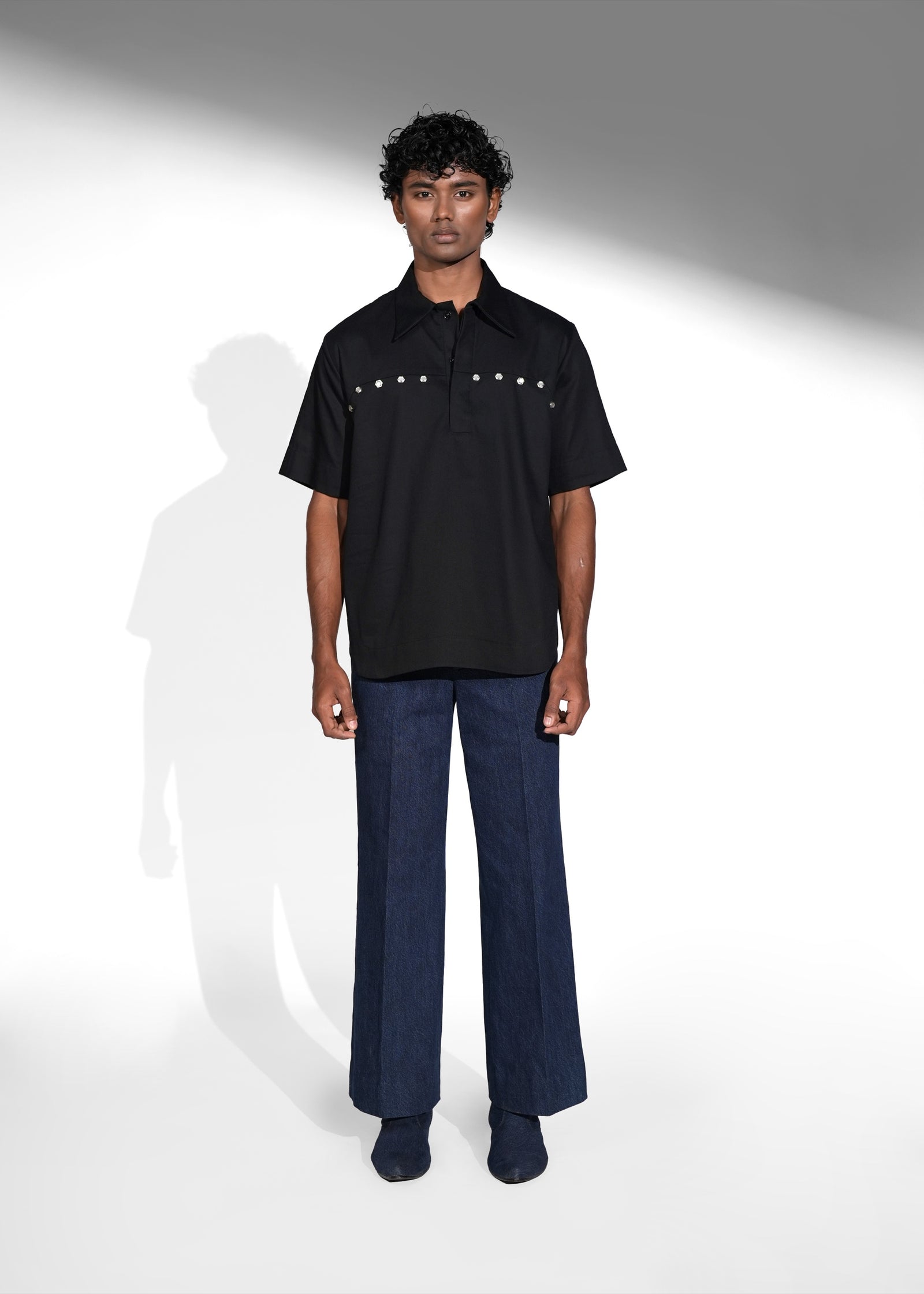 ROSANI The Vaulta shirt in black - half-sleeve cotton shirt with metallic button shoulder joint detail, front view