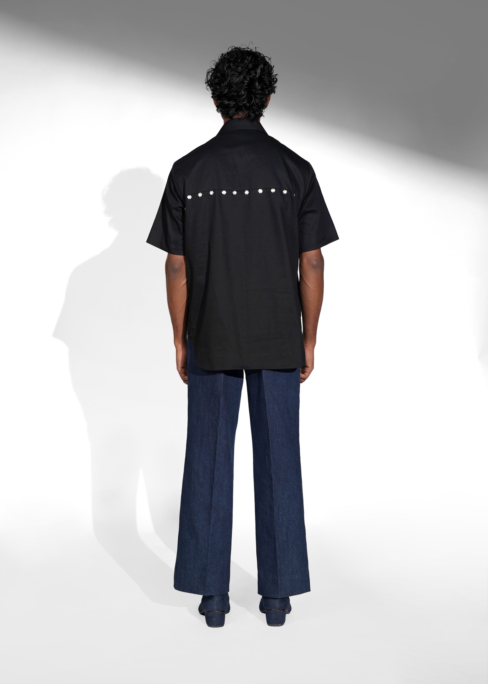 ROSANI The Vaulta shirt in black - half-sleeve cotton shirt with metallic button detail, back view