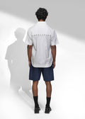 ROSANI The Vaulta shirt in white - half-sleeve cotton shirt with metallic button detail, back view