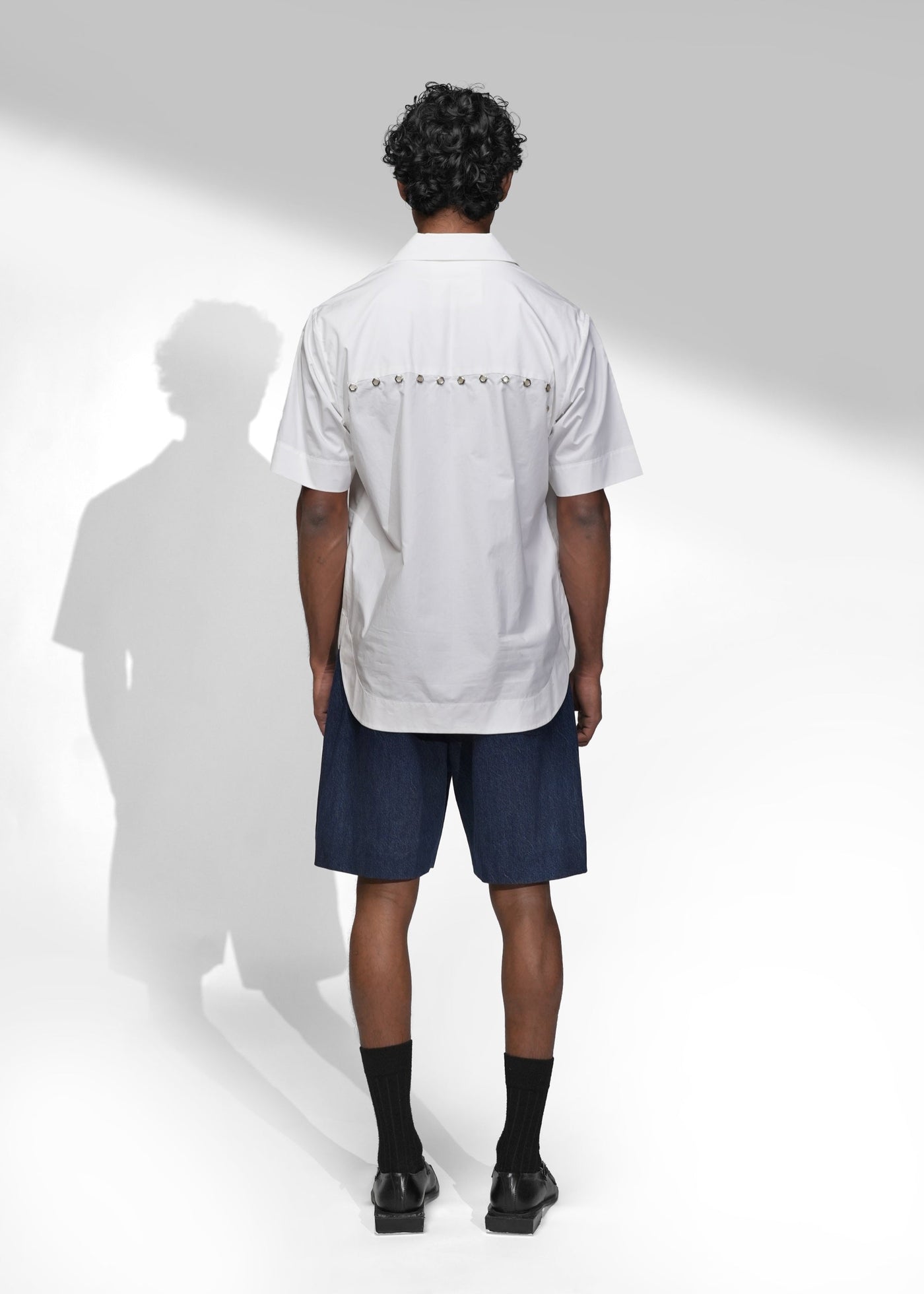 ROSANI The Vaulta shirt in white - half-sleeve cotton shirt with metallic button detail, back view