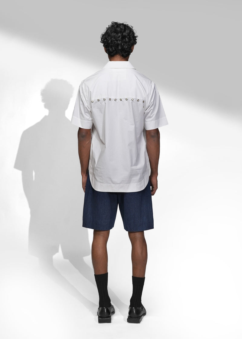 ROSANI The Vaulta shirt in white - short sleeve collared shirt with metal eyelet trim, back view
