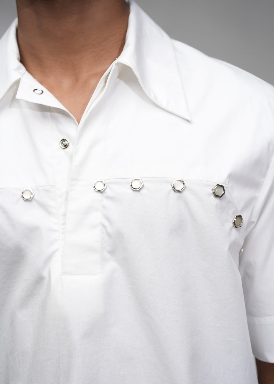 ROSANI The Vaulta shirt in white - metallic button shoulder joint detail, close-up