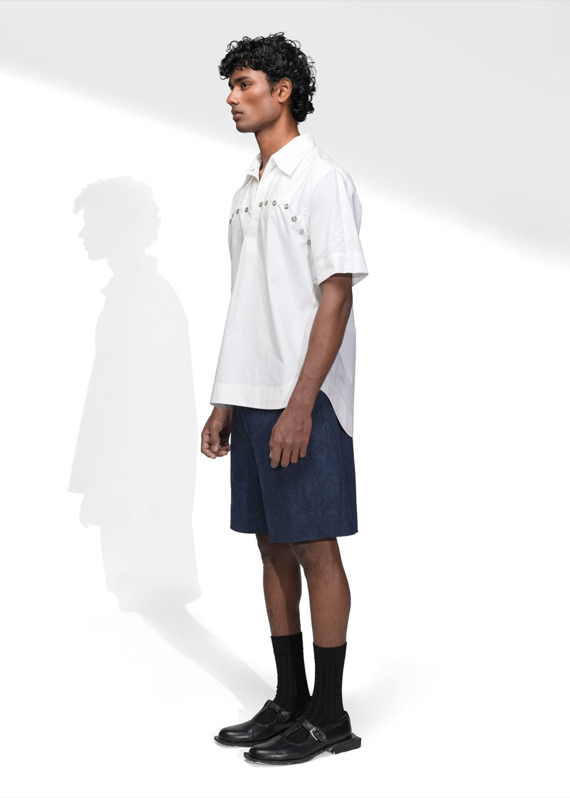ROSANI The Vaulta shirt in white - short sleeve collared shirt with metal eyelet trim, front side view