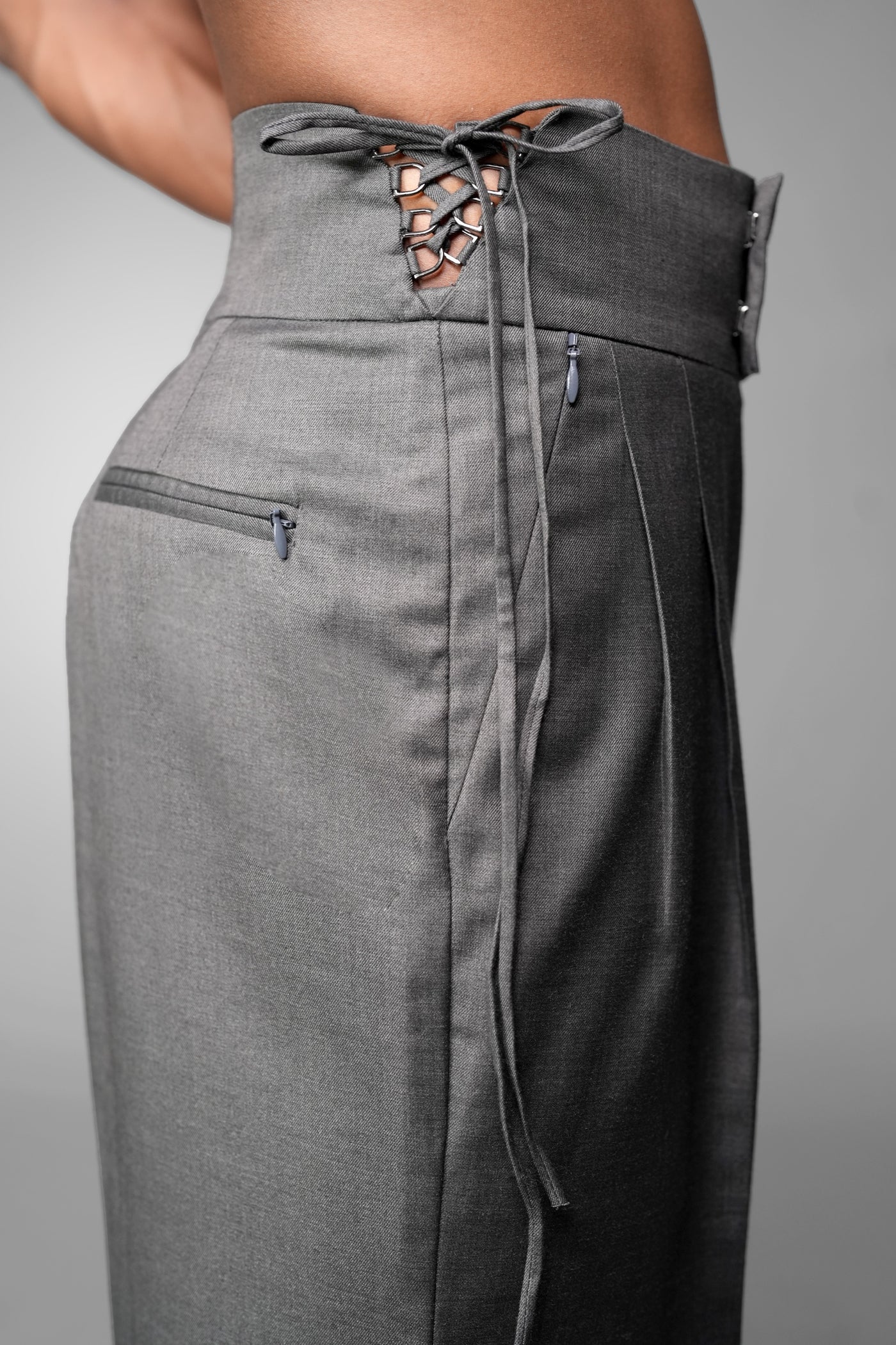 ROSANI The Veil trouser in grey - lace-up high waistband and zip pocket detail, close-up