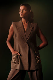 ROSANI The Vessel blazer in grey - sleeveless blazer with padded shoulders and embellished pockets, editorial front view