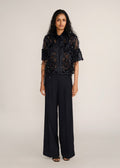 ROSANI The Aether vest in obsidian - obsidian hand-woven strip vest with botanical metallic embroidery, front view