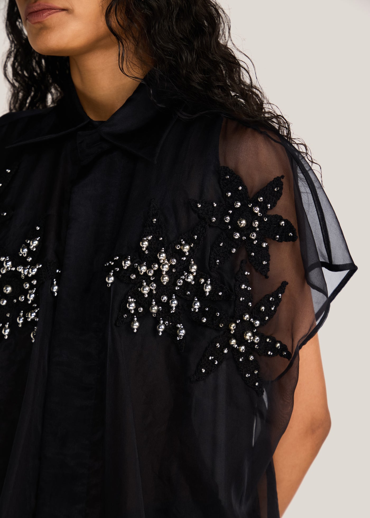 ROSANI The Antaral shirt in black - black organza sleeveless shirt with hand-crocheted botanical motifs, craft detail
