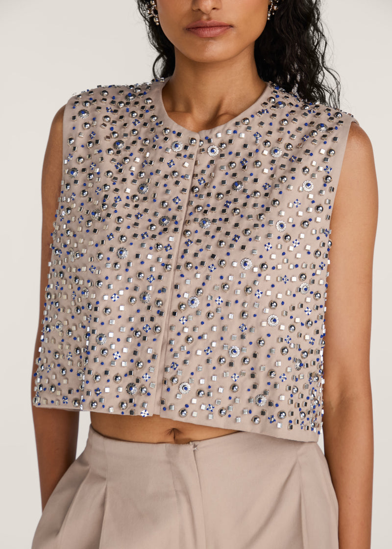 ROSANI The Cercania vest in sand dune - sand dune cropped vest with all-over metal second-skin embroidery, craft detail