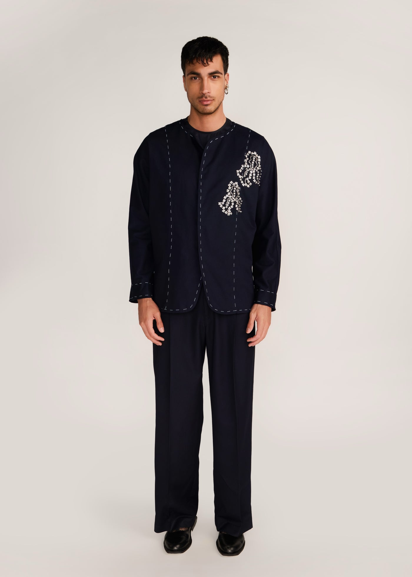 ROSANI The Cohors shacket in black - black cotton shacket with metallic botanical embroidery, front view