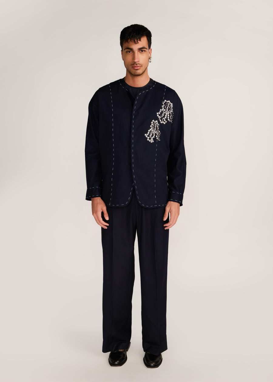 ROSANI The Cohors shacket in black - black cotton shacket with metallic botanical embroidery, front view