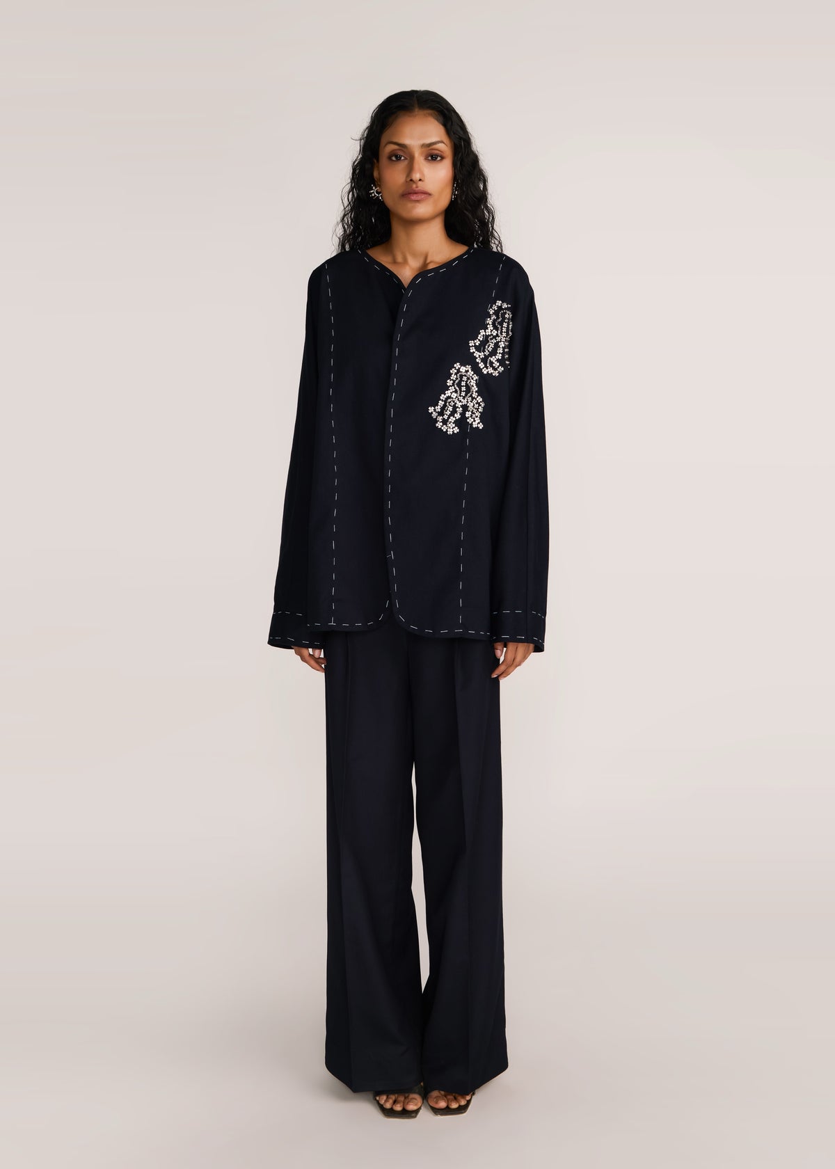 ROSANI The Cohors shacket in black - black cotton shacket with metallic botanical embroidery, front view