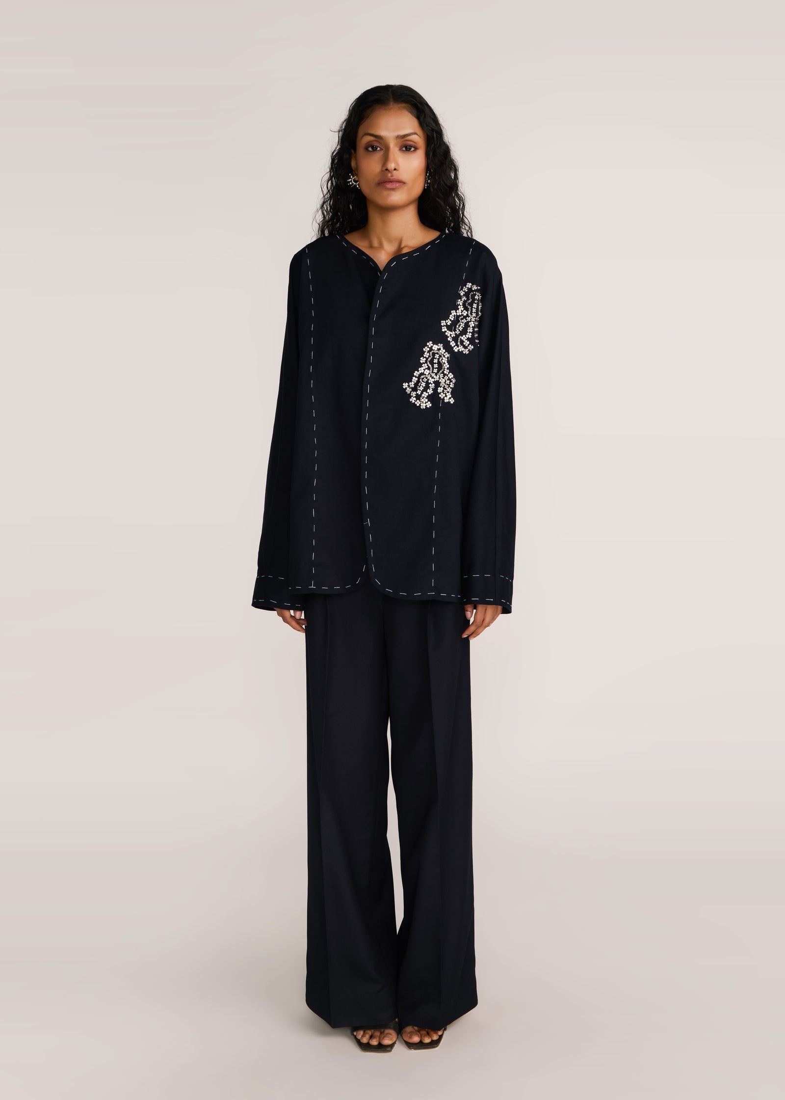 ROSANI The Cohors shacket in black - black cotton shacket with metallic botanical embroidery, front view