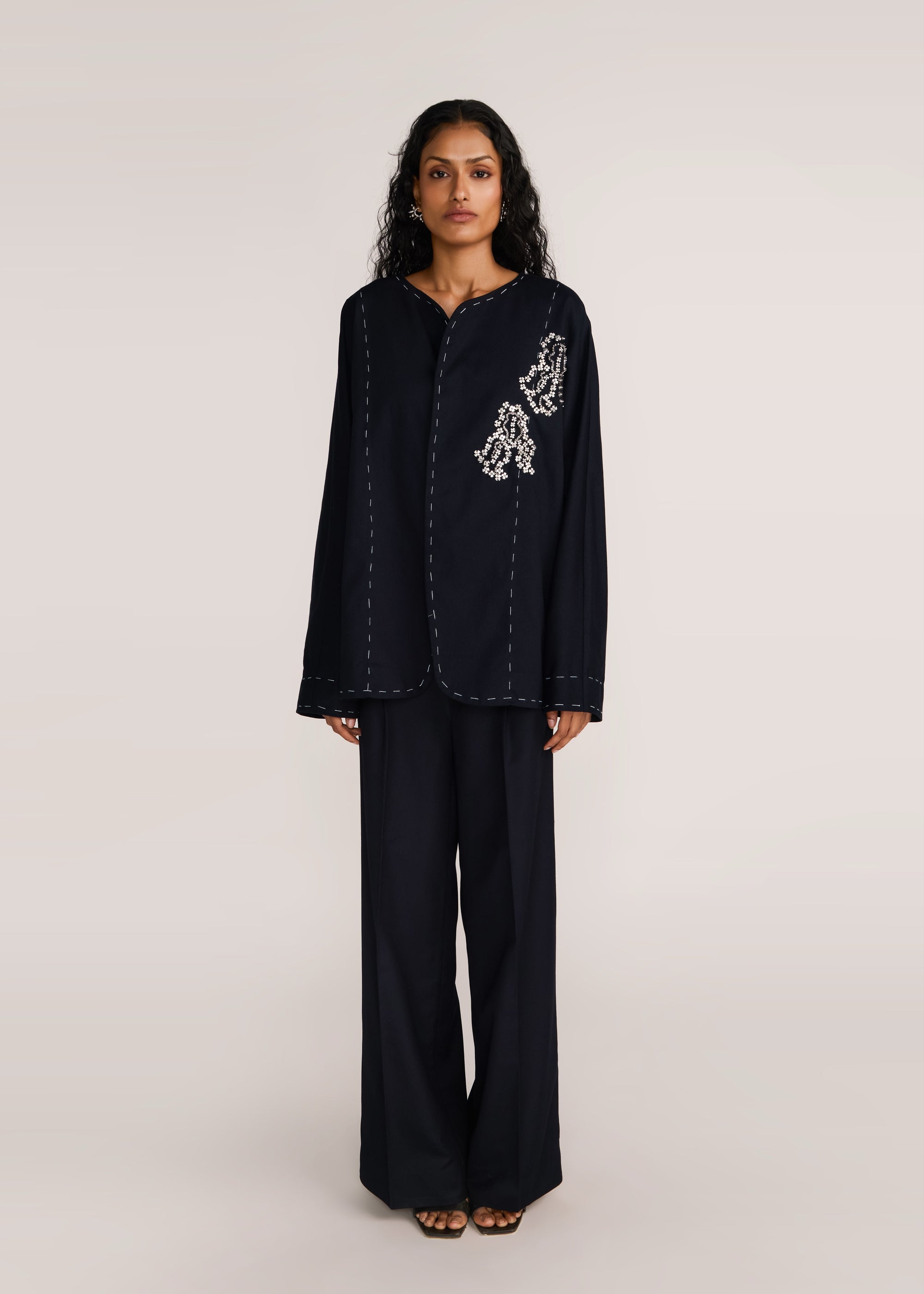 ROSANI The Cohors shacket in black - black cotton shacket with metallic botanical embroidery, front view