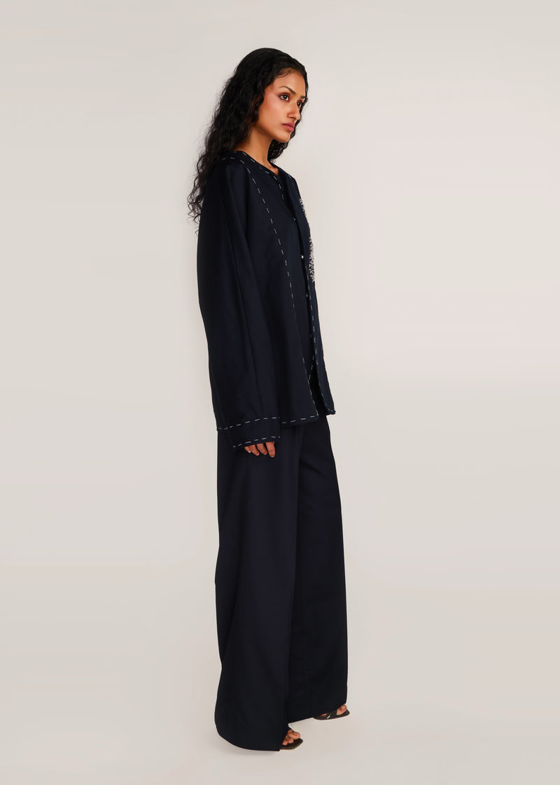 ROSANI The Cohors shacket in black - black cotton shacket with metallic botanical embroidery, side view