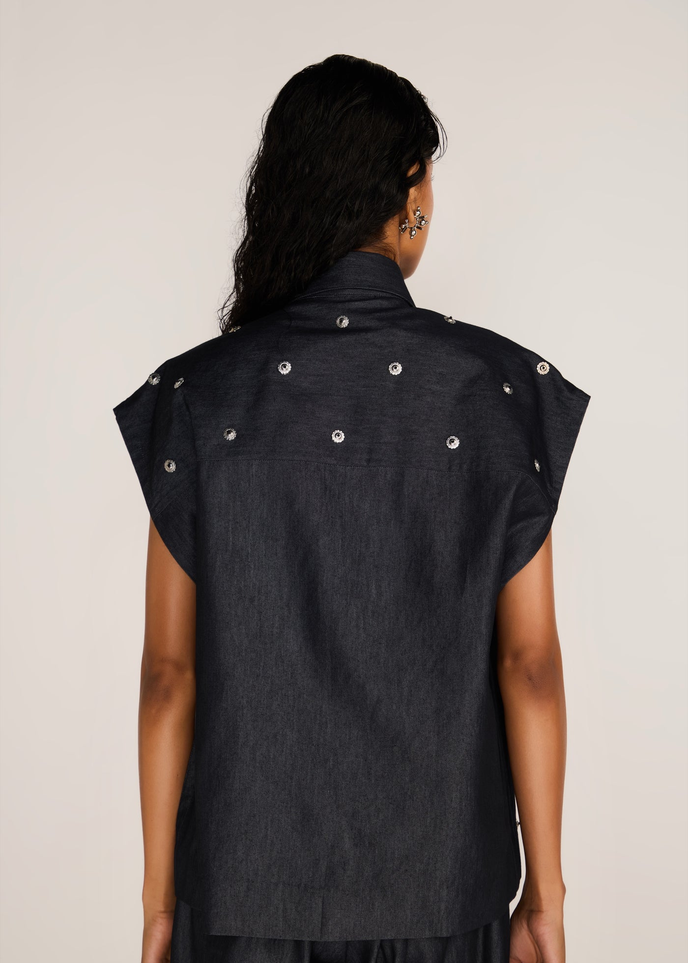 ROSANI The Converis shirt in charcoal - charcoal denim sleeveless shirt with metal flower embroidery, back view
