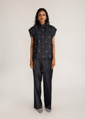 ROSANI The Converis shirt in charcoal - charcoal denim sleeveless shirt with metal flower embroidery, front view