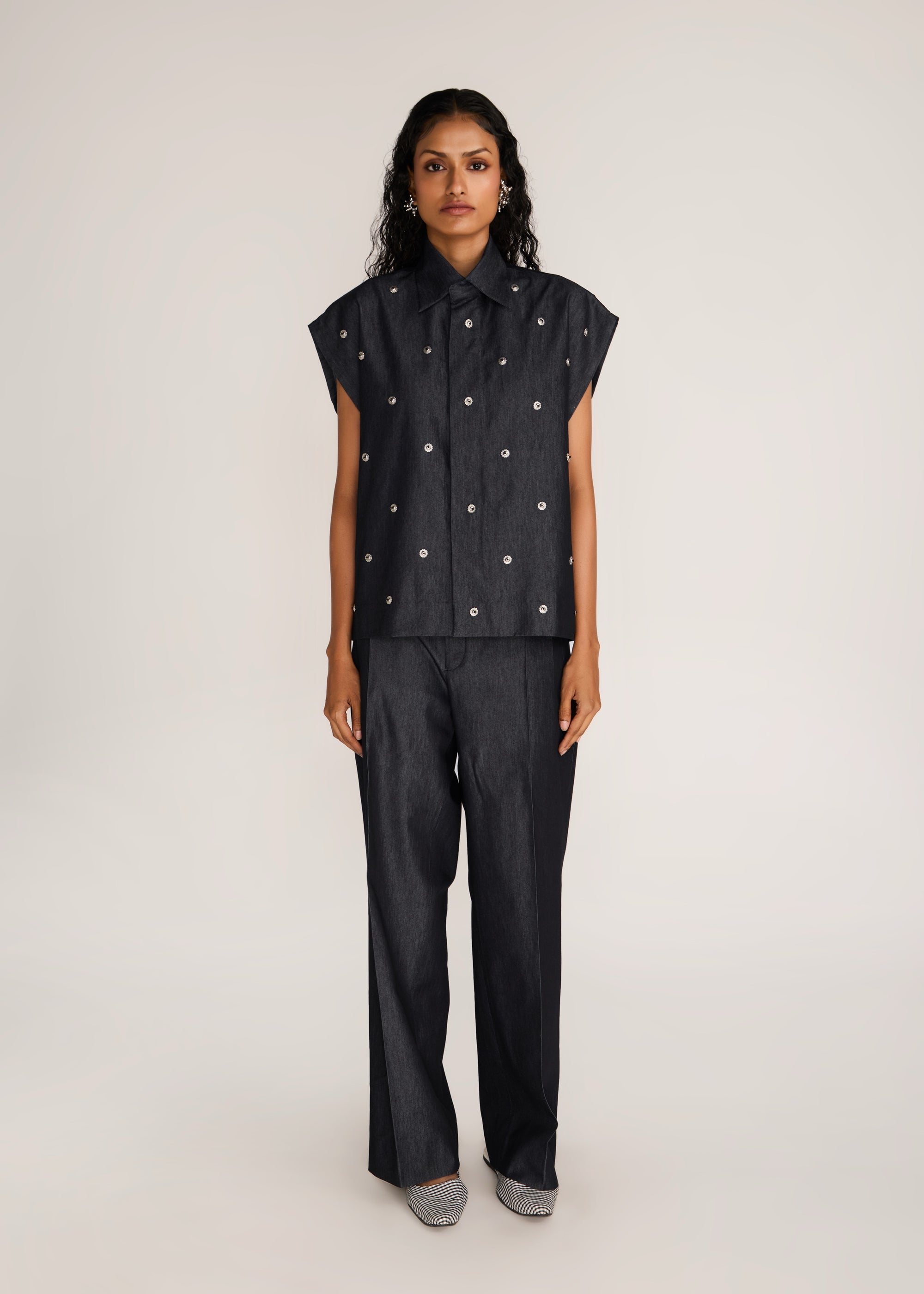 ROSANI The Converis shirt in charcoal - charcoal denim sleeveless shirt with metal flower embroidery, front view