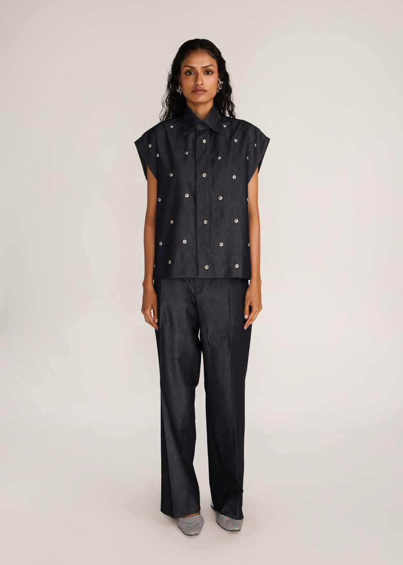 ROSANI The Converis shirt in charcoal - charcoal denim sleeveless shirt with metal flower embroidery, front view