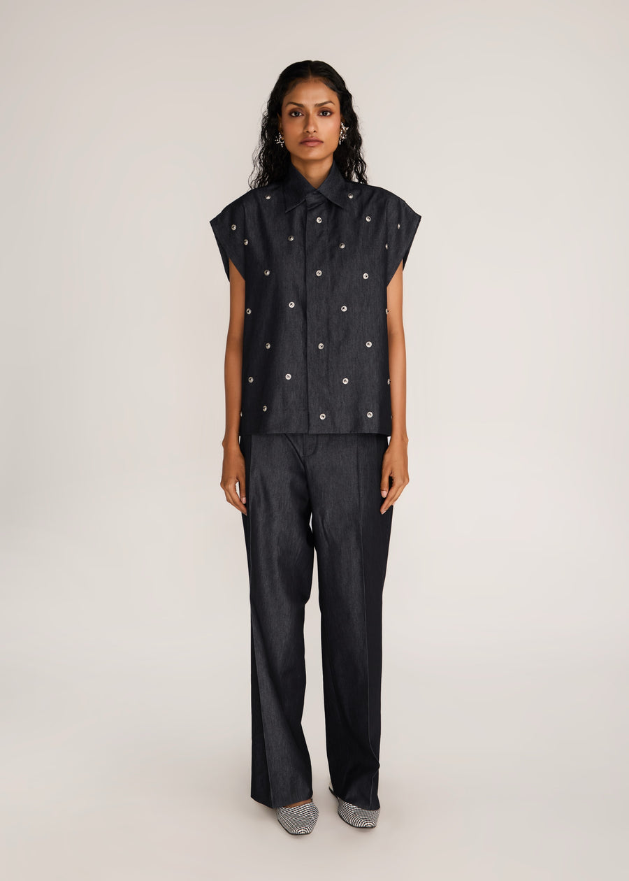 ROSANI The Converis shirt in charcoal - charcoal denim sleeveless shirt with metal flower embroidery, front view