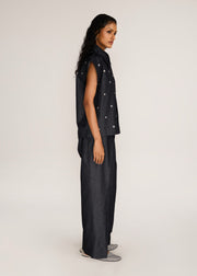ROSANI The Converis shirt in charcoal - charcoal denim sleeveless shirt with metal flower embroidery, side view