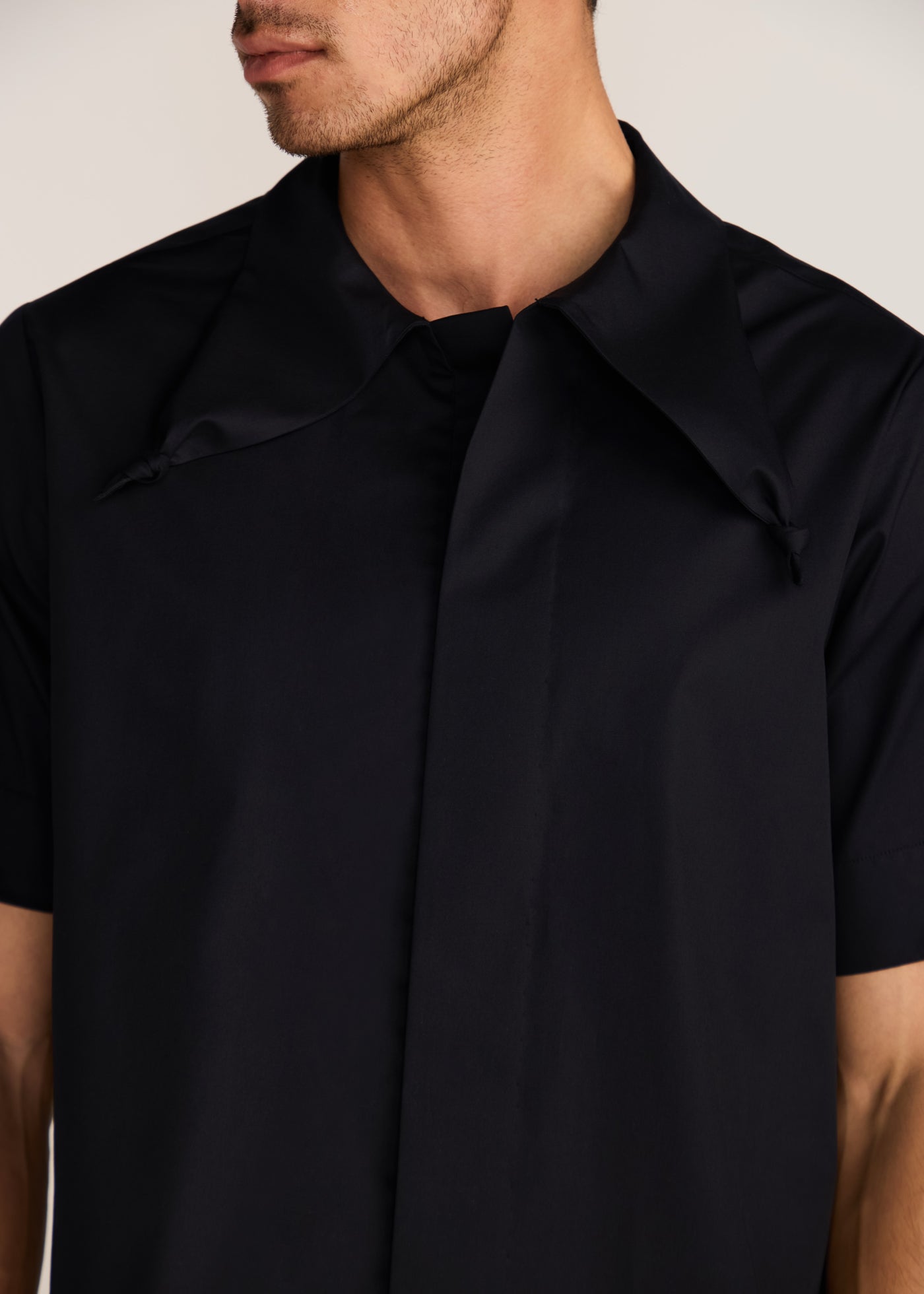 ROSANI The Covra shirt in black - black poplin bandana-collar knot-back half-sleeve shirt, craft detail