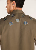 ROSANI The Encuentro vest in deep olive - deep olive utility vest with hand-embroidered silver discs, back view