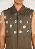 ROSANI The Encuentro vest in deep olive - deep olive utility vest with hand-embroidered silver discs, craft detail