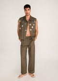 ROSANI The Encuentro vest in deep olive - deep olive utility vest with hand-embroidered silver discs, front view
