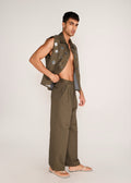 ROSANI The Encuentro vest in deep olive - deep olive utility vest with hand-embroidered silver discs, side view, alternate angle