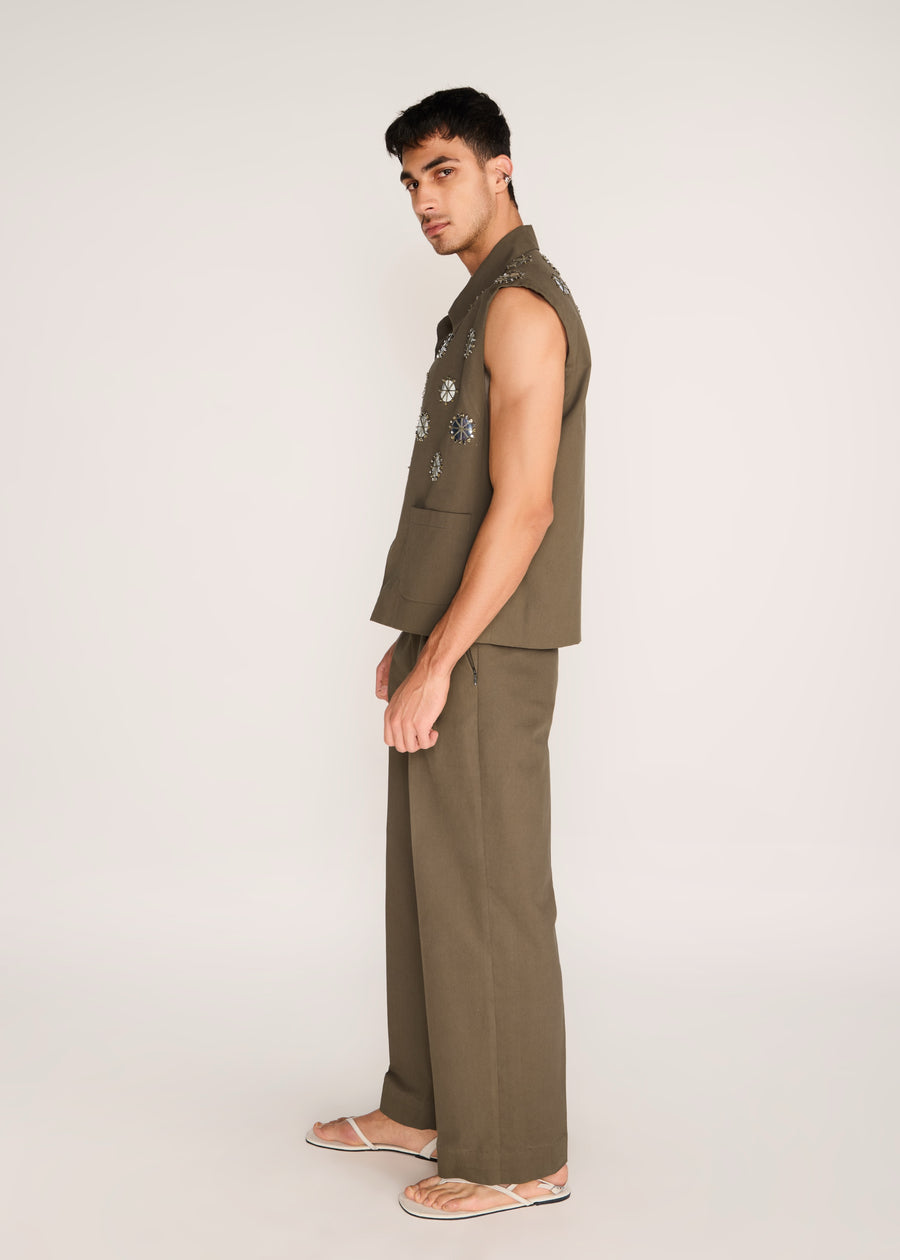 ROSANI The Encuentro vest in deep olive - deep olive utility vest with hand-embroidered silver discs, side view