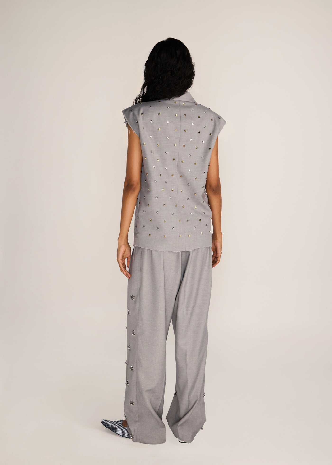 ROSANI The Ilchi trouser in steel - steel fluid suiting trouser with metal botanical accents, back view