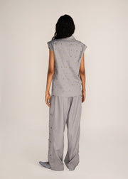 ROSANI The Ilchi trouser in steel - steel fluid suiting trouser with metal botanical accents, back view