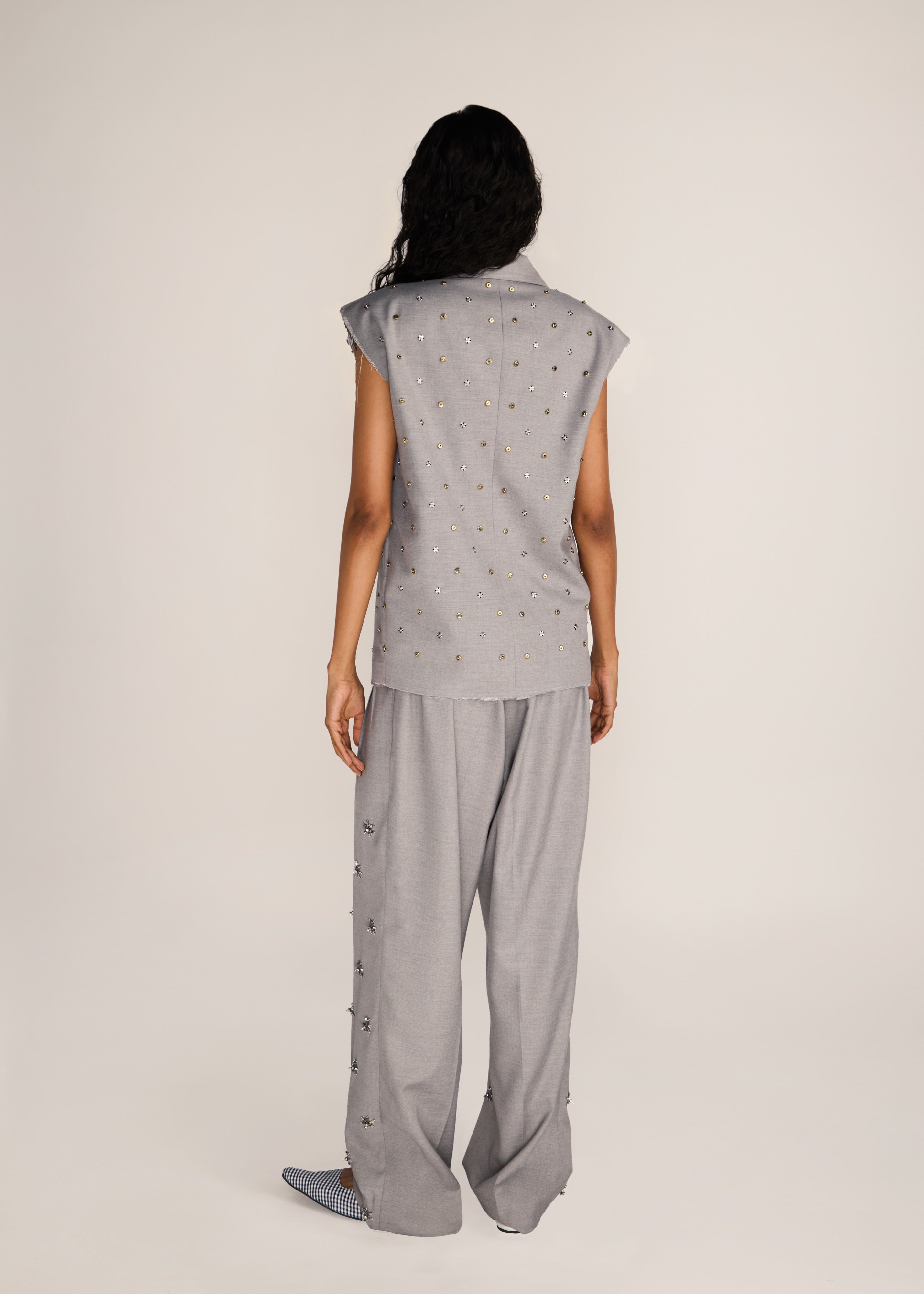 ROSANI The Ilchi trouser in steel - steel fluid suiting trouser with metal botanical accents, back view