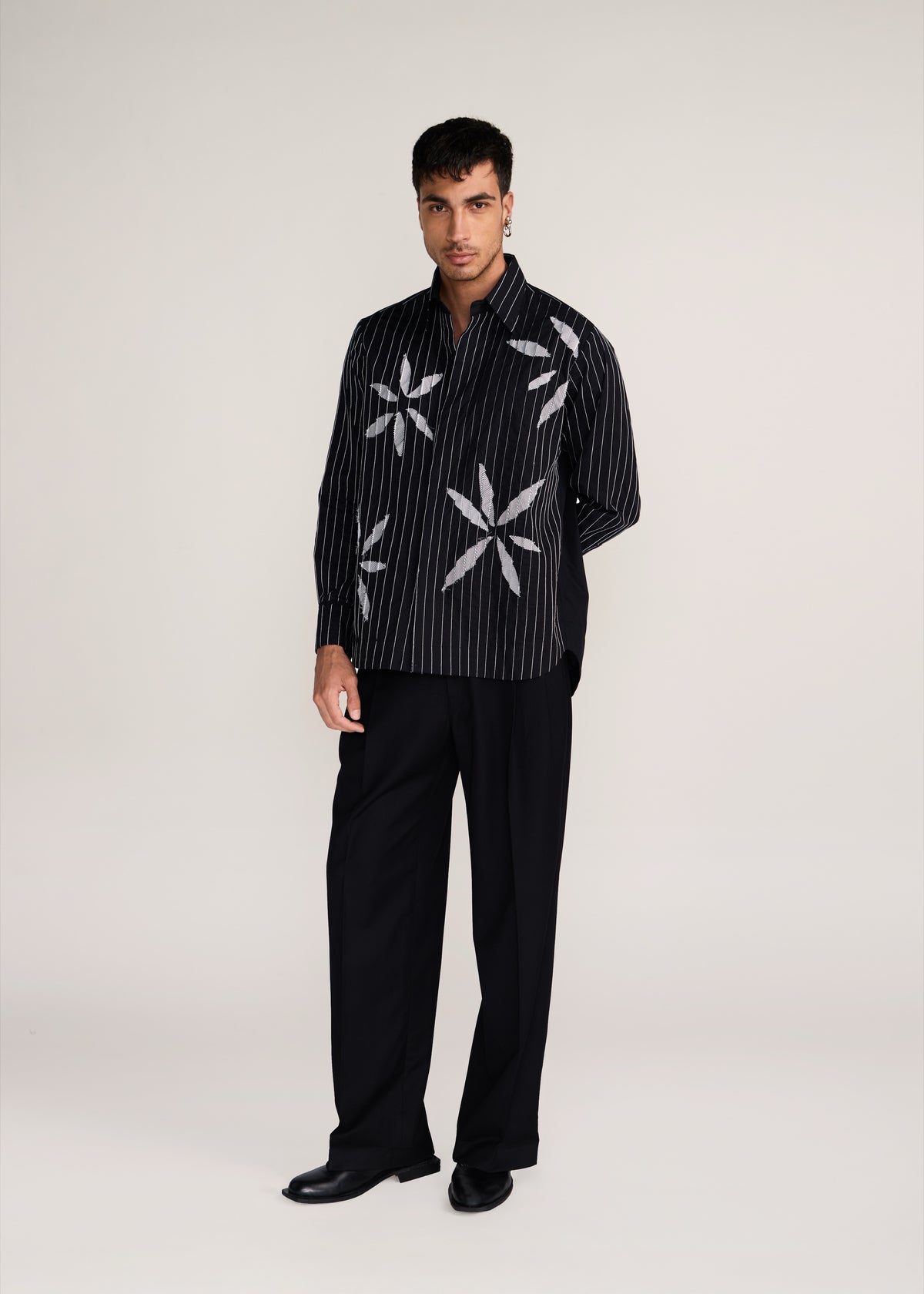 ROSANI The Kisuna shirt in black - black striped shirt with hand-embroidered raw-edge petals, front view