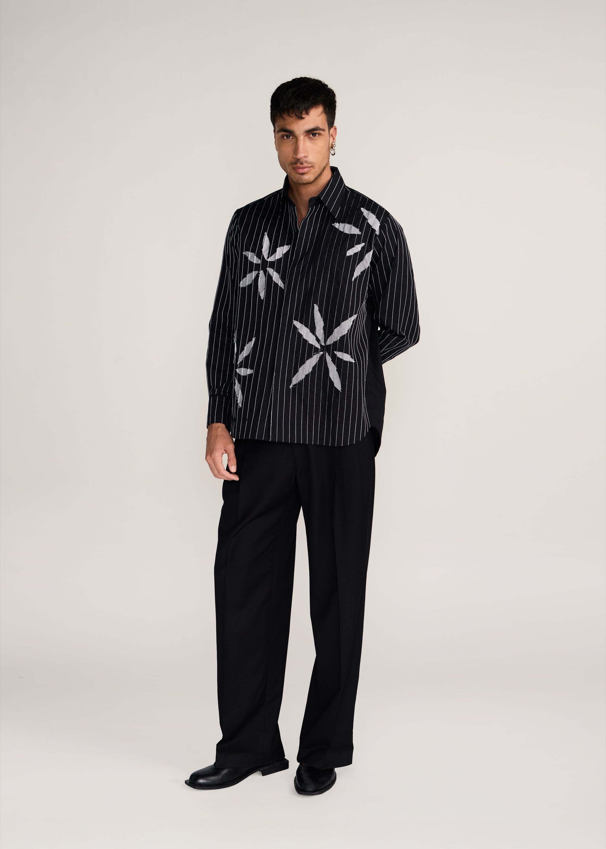 ROSANI The Kisuna shirt in black - black striped shirt with hand-embroidered raw-edge petals, front view