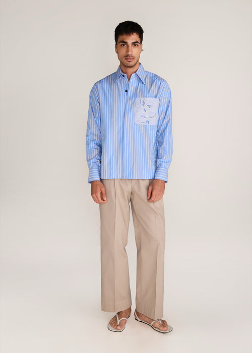 ROSANI The Mannam shirt in dreamy blue - dreamy blue striped shirt with cutwork flower panels, front view