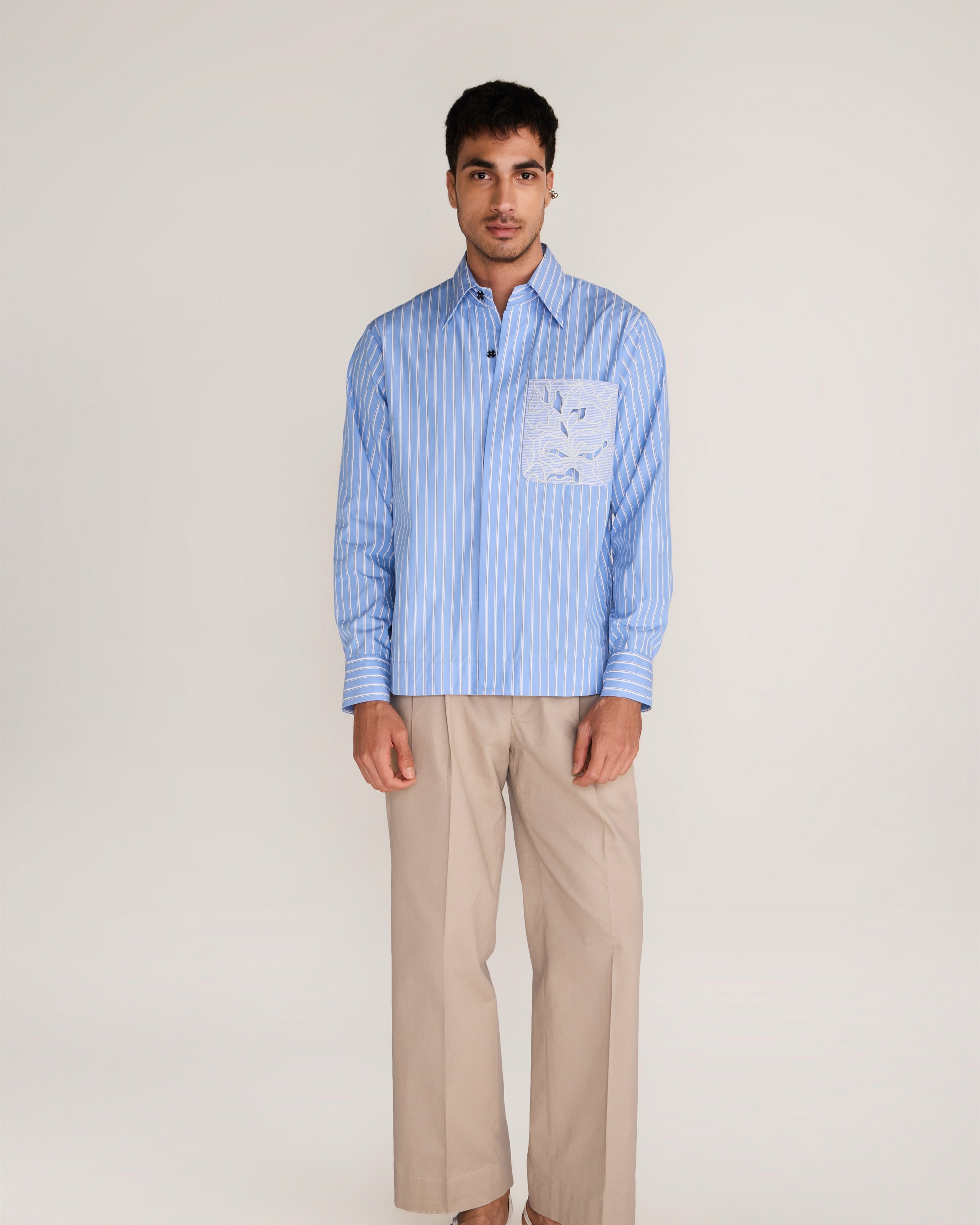 ROSANI The Mannam shirt in dreamy blue - dreamy blue striped shirt with cutwork flower panels, front view