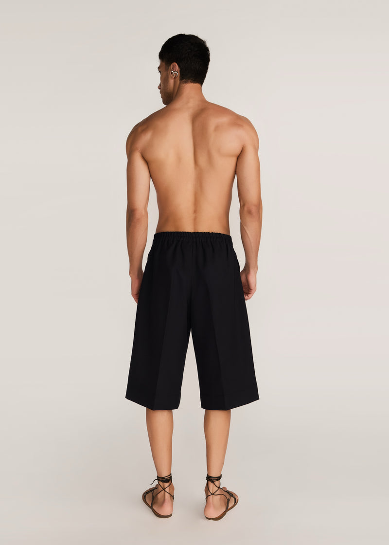 ROSANI The Nerza shorts in obsidian - obsidian suiting culotte shorts, back view