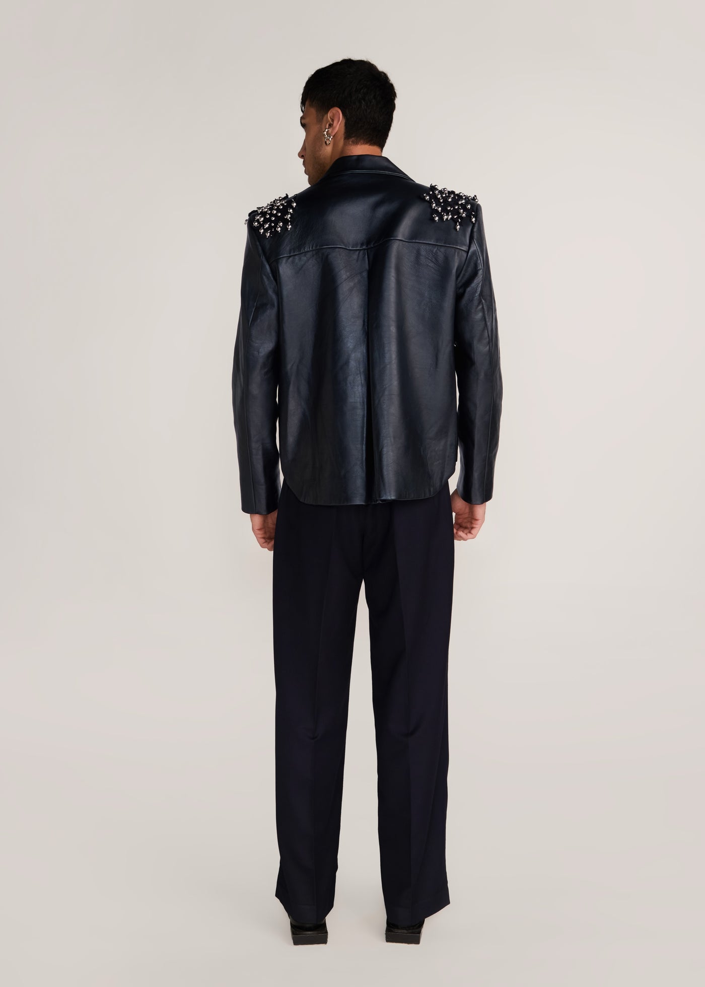 ROSANI The Samklang jacket in obsidian - obsidian leather jacket with hand-crocheted botanical shoulders, back view