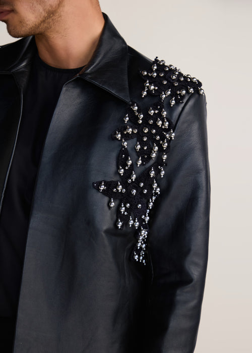 ROSANI The Samklang jacket in obsidian - obsidian leather jacket with hand-crocheted botanical shoulders, craft detail