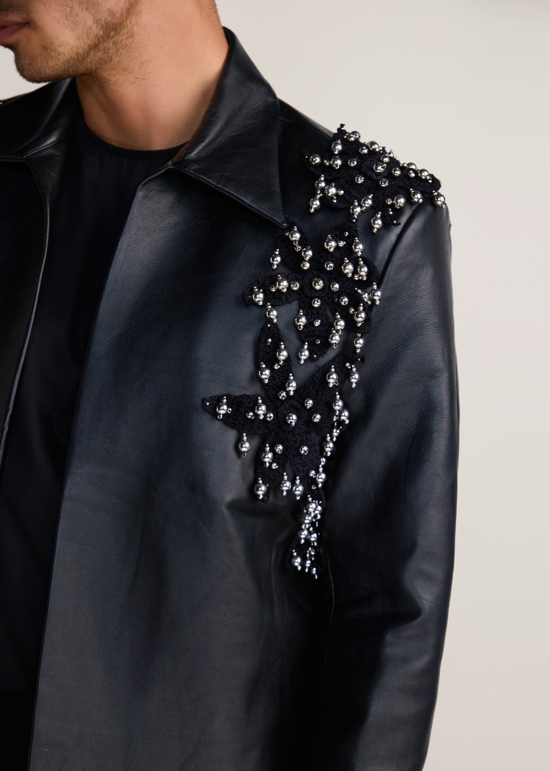 ROSANI The Samklang jacket in obsidian - obsidian leather jacket with hand-crocheted botanical shoulders, craft detail